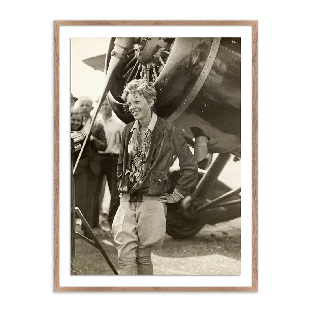 Amelia Earhart Beside Her Plane By Getty Images - 18"X24" - Rustic Walnut