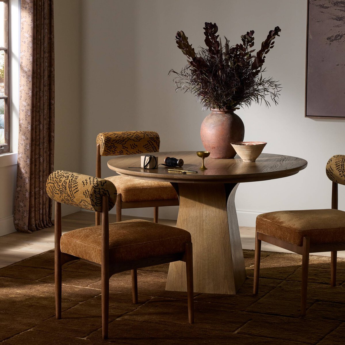 Pattern, texture and warm oak bring an easy sense of character to the dining room.