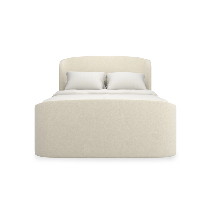Soft Embrace Bed B, shown in ivory and cream with upholstery fabric, textured textile, and fully upholstered headboard.