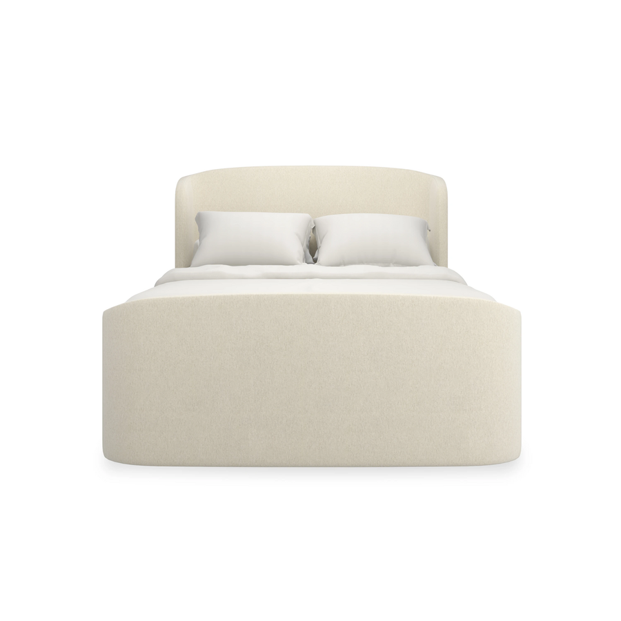 Soft Embrace Bed B, shown in ivory and cream with upholstery fabric, textured textile, and fully upholstered headboard.