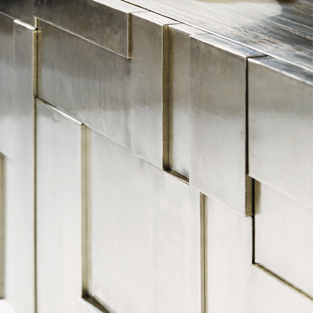 Close-up of metallic tiles with a geometric pattern