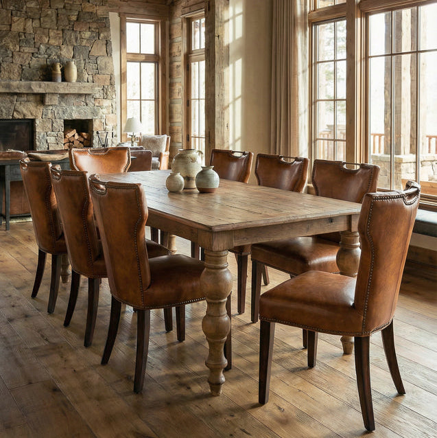 Dining room with wooden table and chairs in a rustic setting