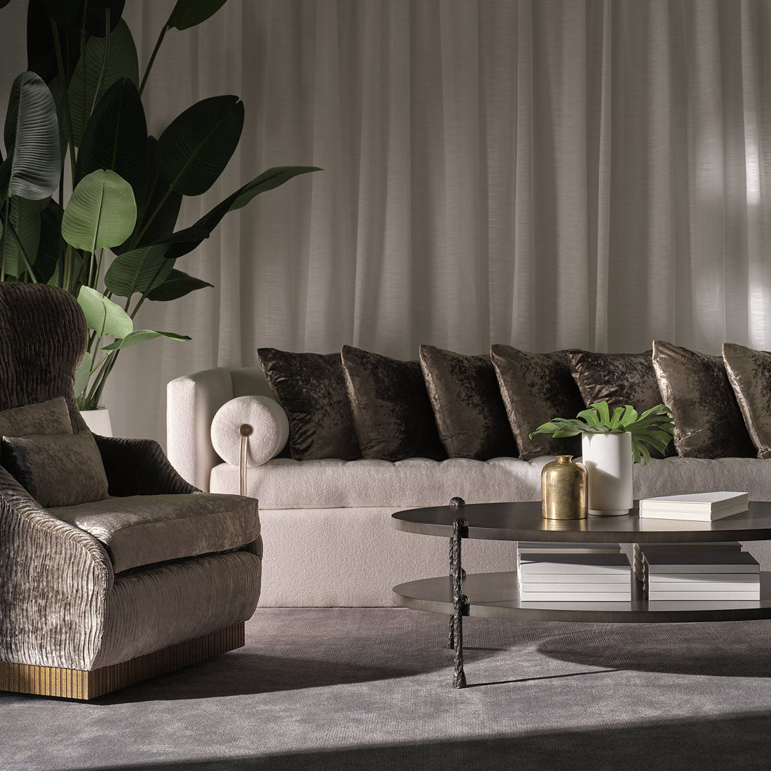 Modern living room with off white sofa, armchair, and coffee table.