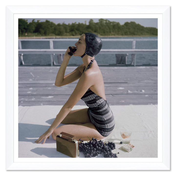 Vogue Magazine, "Young Woman Wearing a Swimsuit Eating Grapes", John Rawlings, January 1, 1953 by Soicher Marin