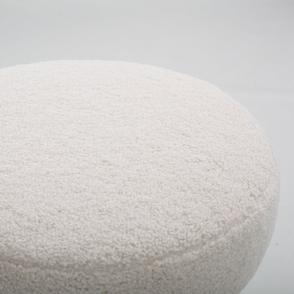 Close-up of a textured white stone on a light gray background