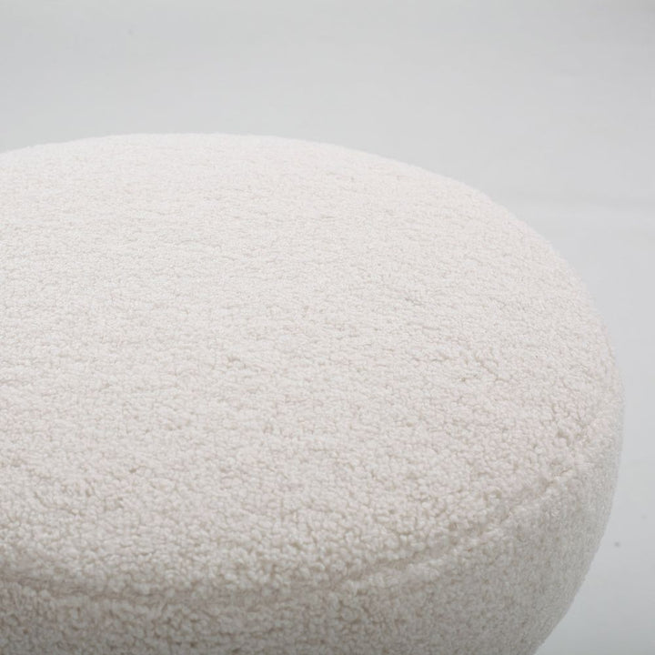 Close-up of a textured white stone on a light gray background