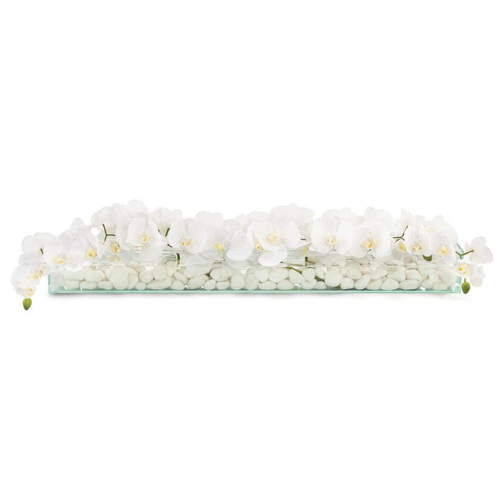Drifting Orchids, shown in white and clear with glass, marble pebbles, and long rectangular clear glass tray.
