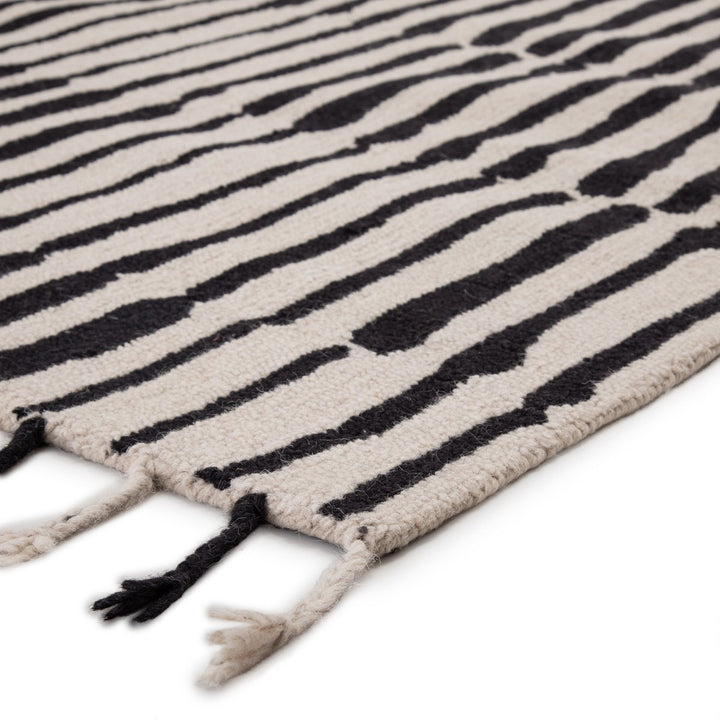 Nikki Chu by Jaipur Living Saville Handmade Tribal Black/ Ivory Area Rug (9'X12')