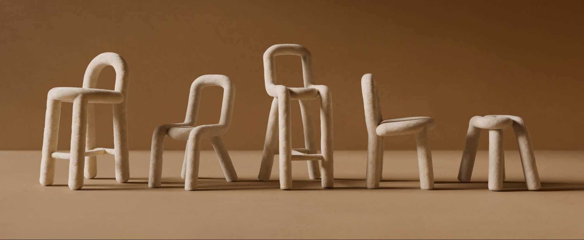 Set of five beige chairs arranged in a row against a brown background
