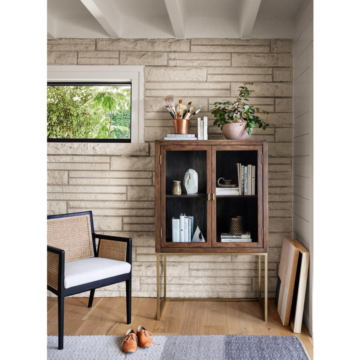 Antonia Cane Dining Arm Chair styled beside a cabinet; other furniture and accessories not included