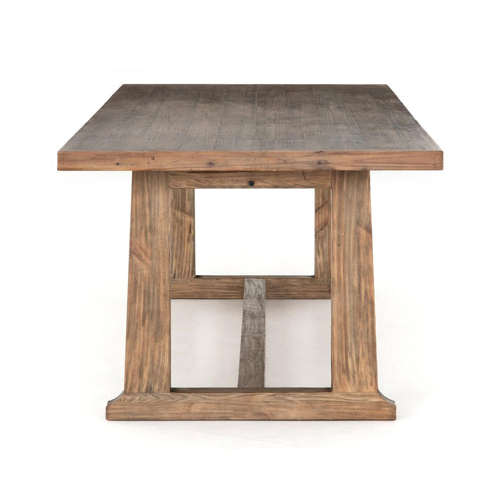End view of the Four Hands Otto Dining Table showing its trestle base