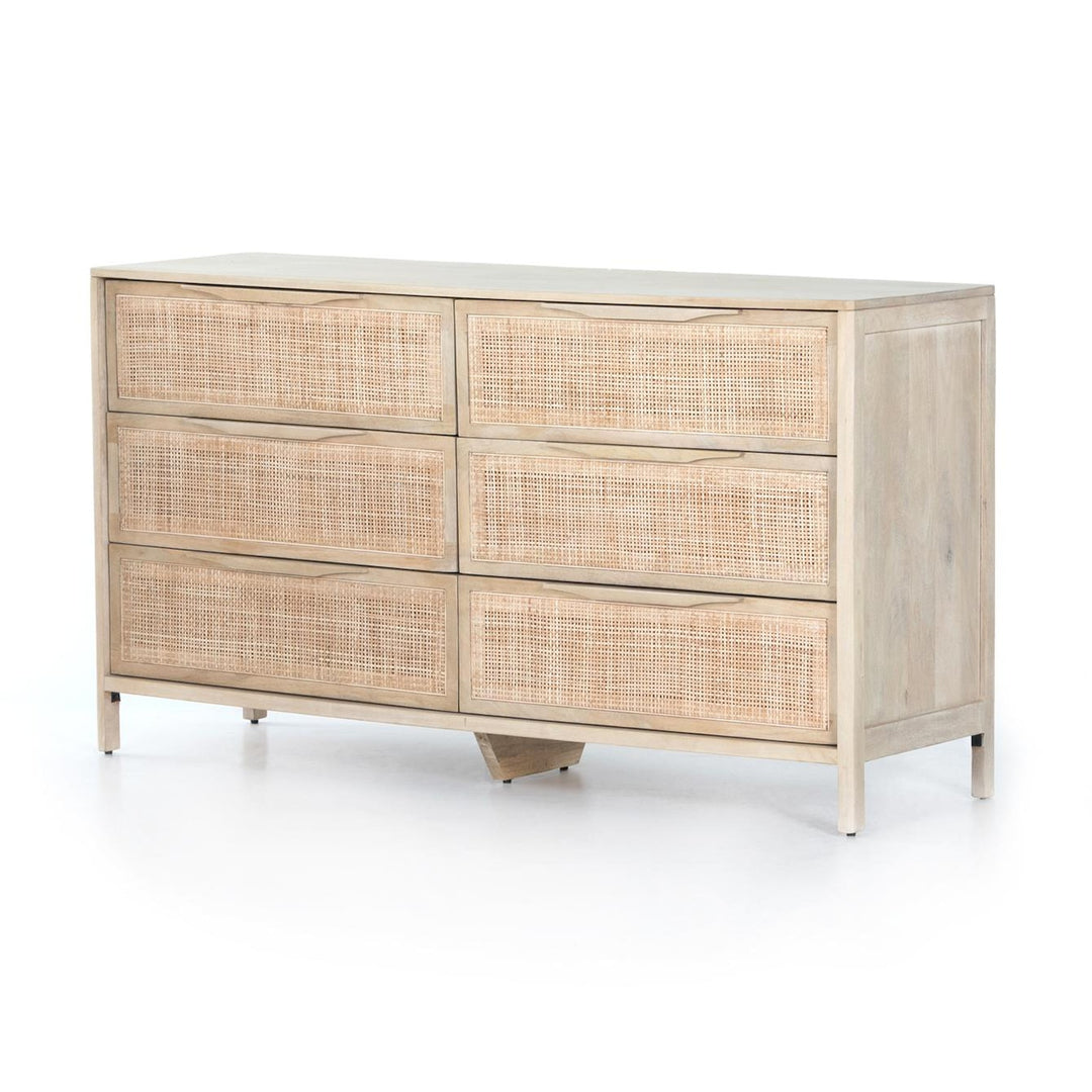 Four Hands Sydney 6-Drawer Dresser in natural mango with woven cane drawer fronts, three-quarter view