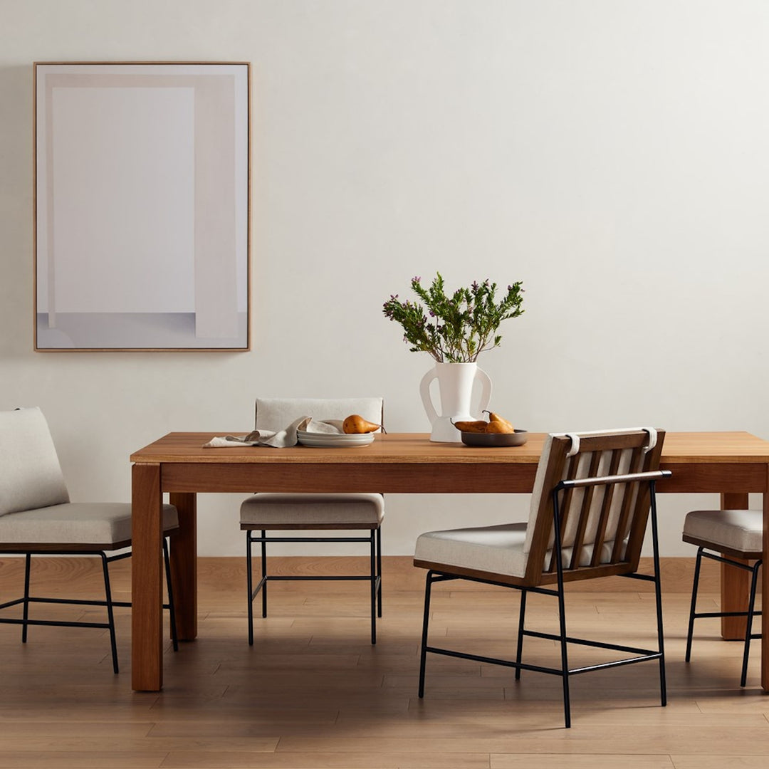 Timur natural teak veneer dining table shown in a dining room setting; chairs and accessories not included