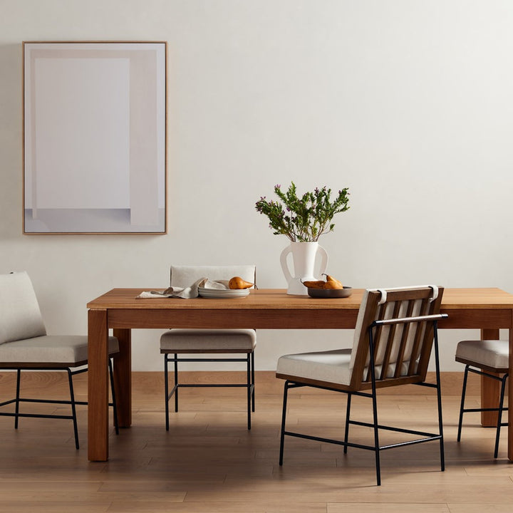 Timur natural teak veneer dining table shown in a dining room setting; chairs and accessories not included