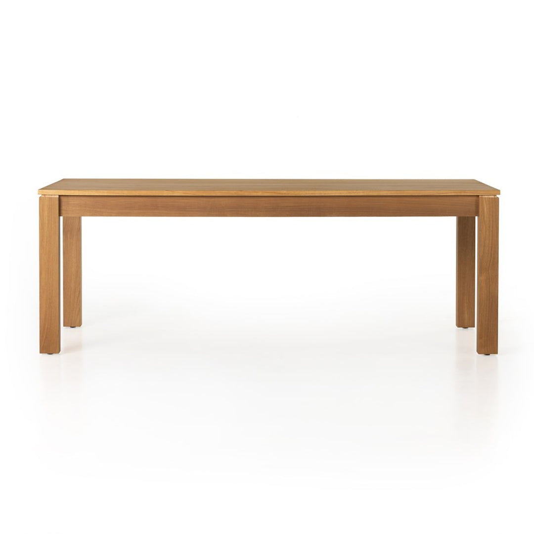 Front view of the Timur dining table showing its straight apron and Parsons-style legs