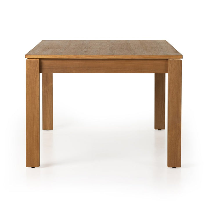 End view of the Timur dining table showing the natural teak veneer tabletop and legs