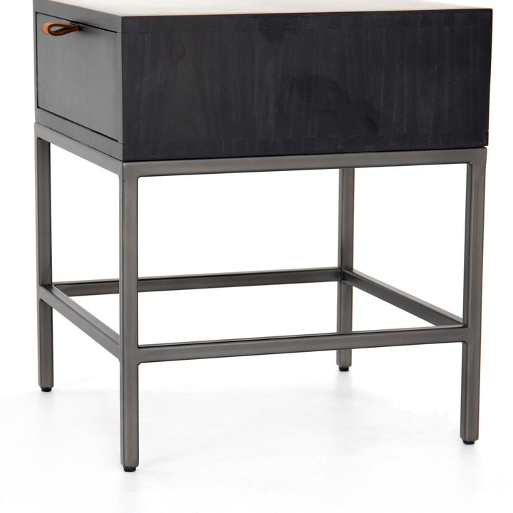 Detail of the Trey End Table wood cabinet, natural iron base and toffee leather pull