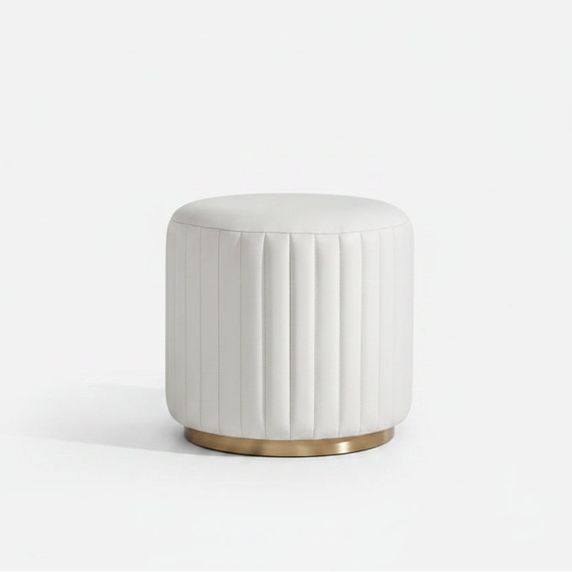 round white leather ottoman with ribbed leather and brass base
