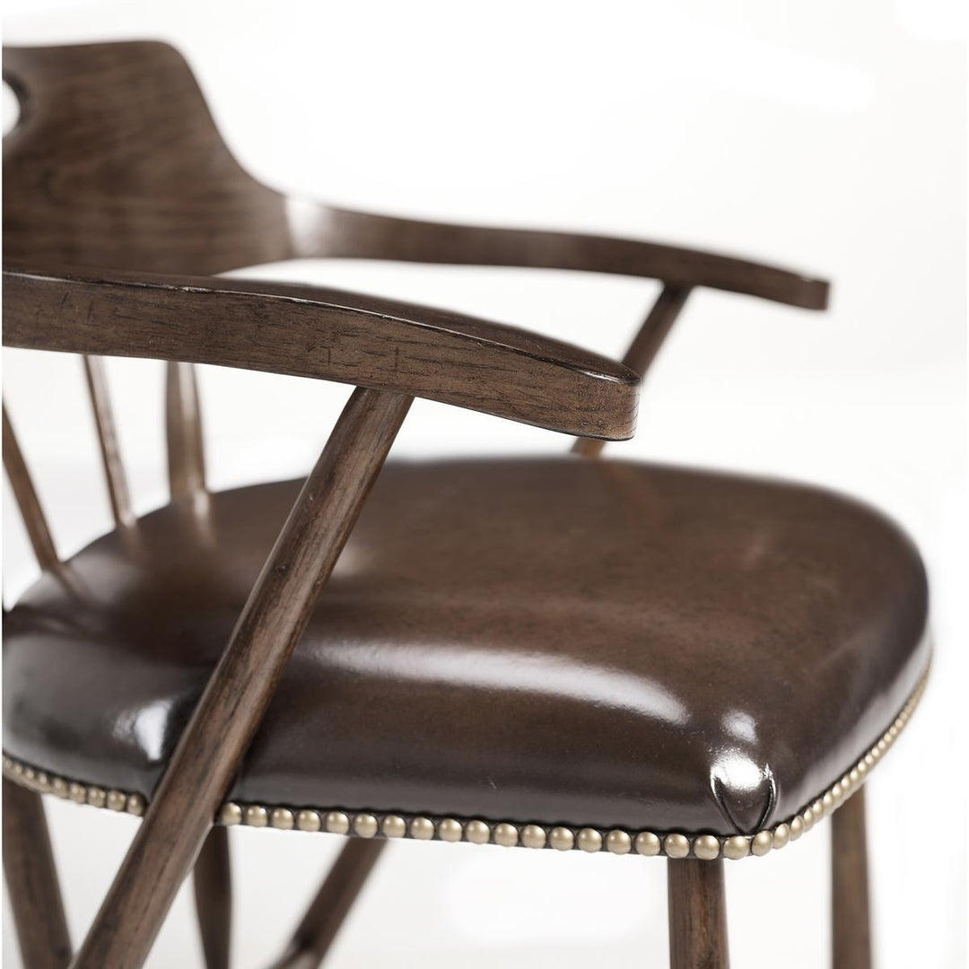Jonathan Charles dark oak counter stool arm and chestnut leather upholstery detail