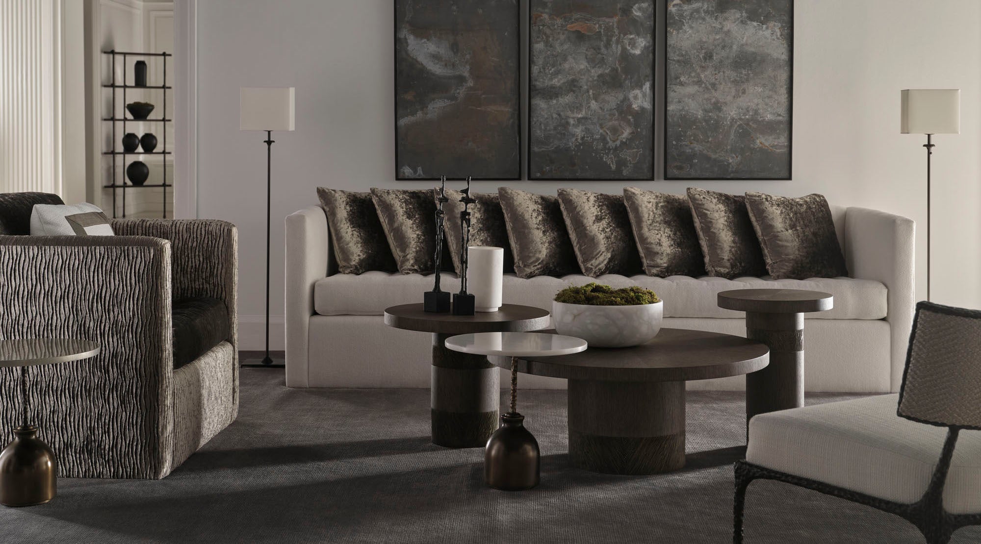 Modern living room with off white sofa, armchair, and coffee table.