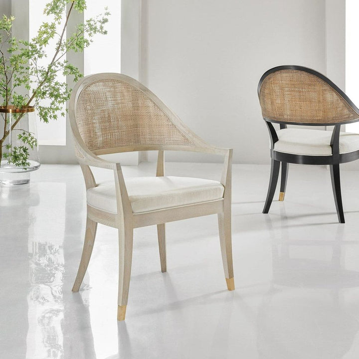 Lyon Chair, shown in light ash wood and natural cane with wood, cane rattan, and fixed arms.
